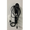Sturdy EV charging connector hanger with universal hook
